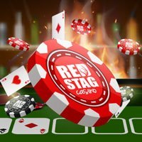 Red Casino chips falling on a table with poker cards, Red stag Casino logo on the chips