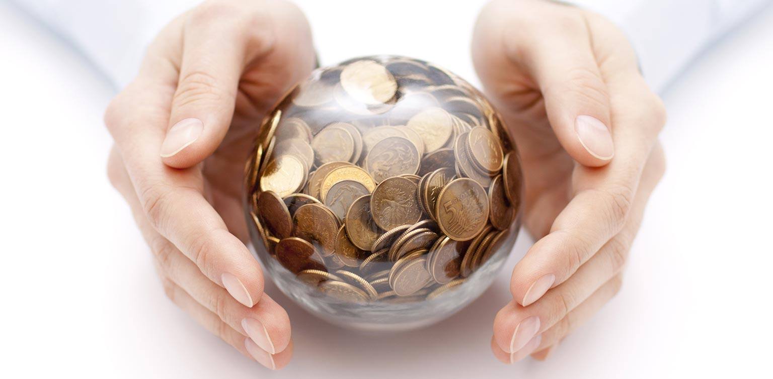 A photo of hands holding a crystal ball filled with coins on a white background